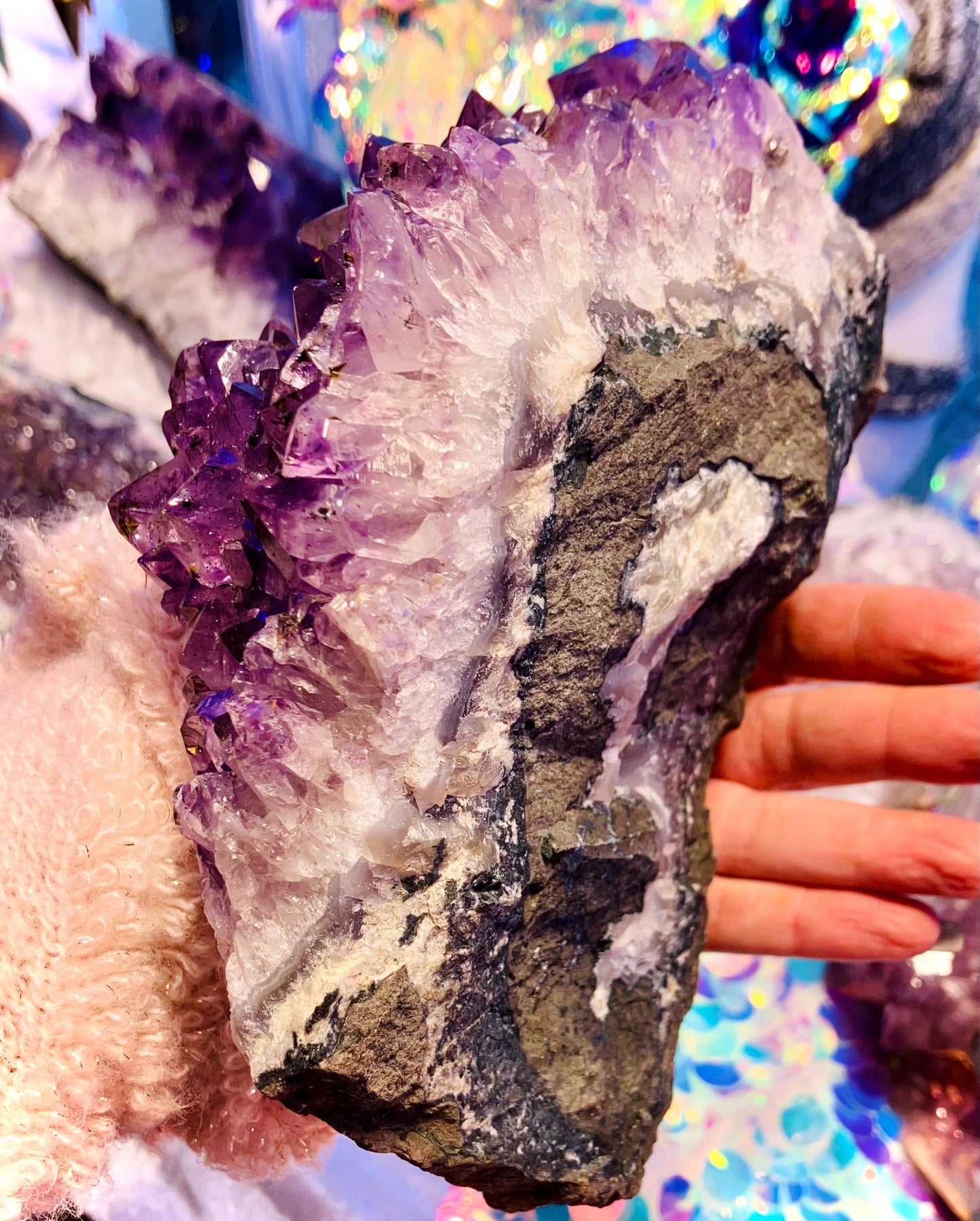 Giant amethyst druse with goethite inclusion