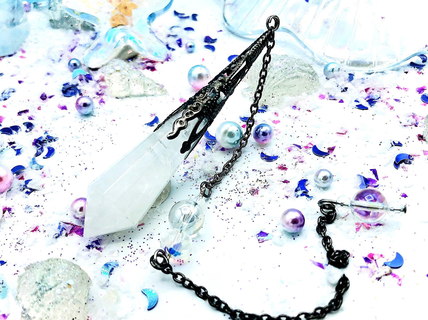 Crystal and aura quartz pendulum