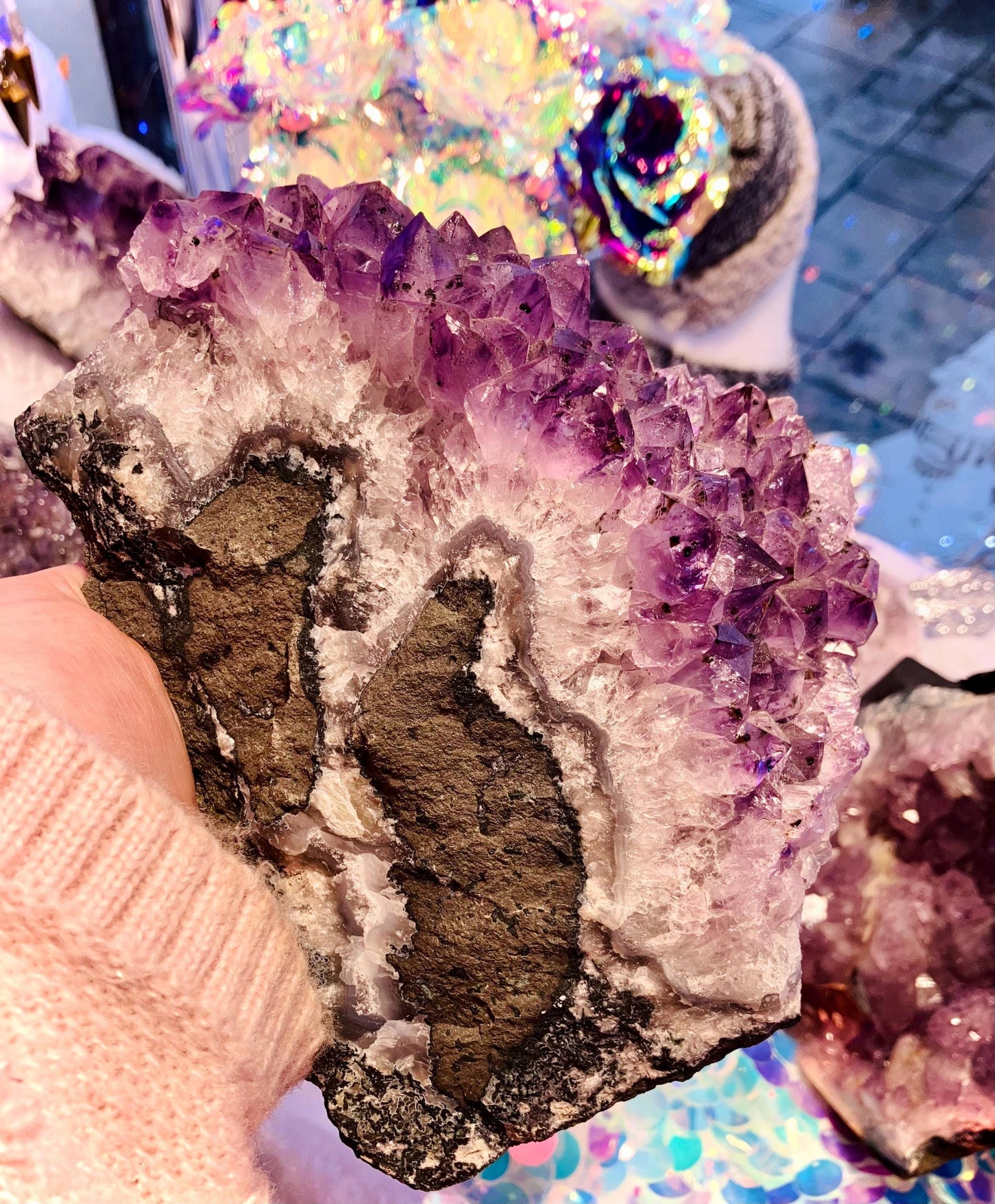 Giant amethyst druse with goethite inclusion