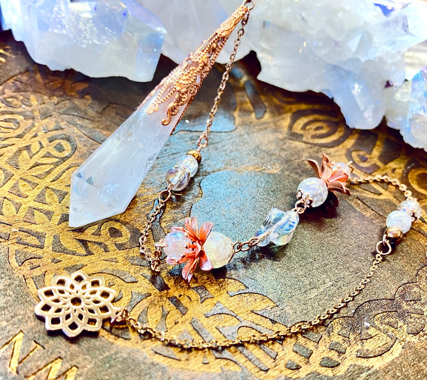 Crystal and aura quartz pendulum with cracked angel flower