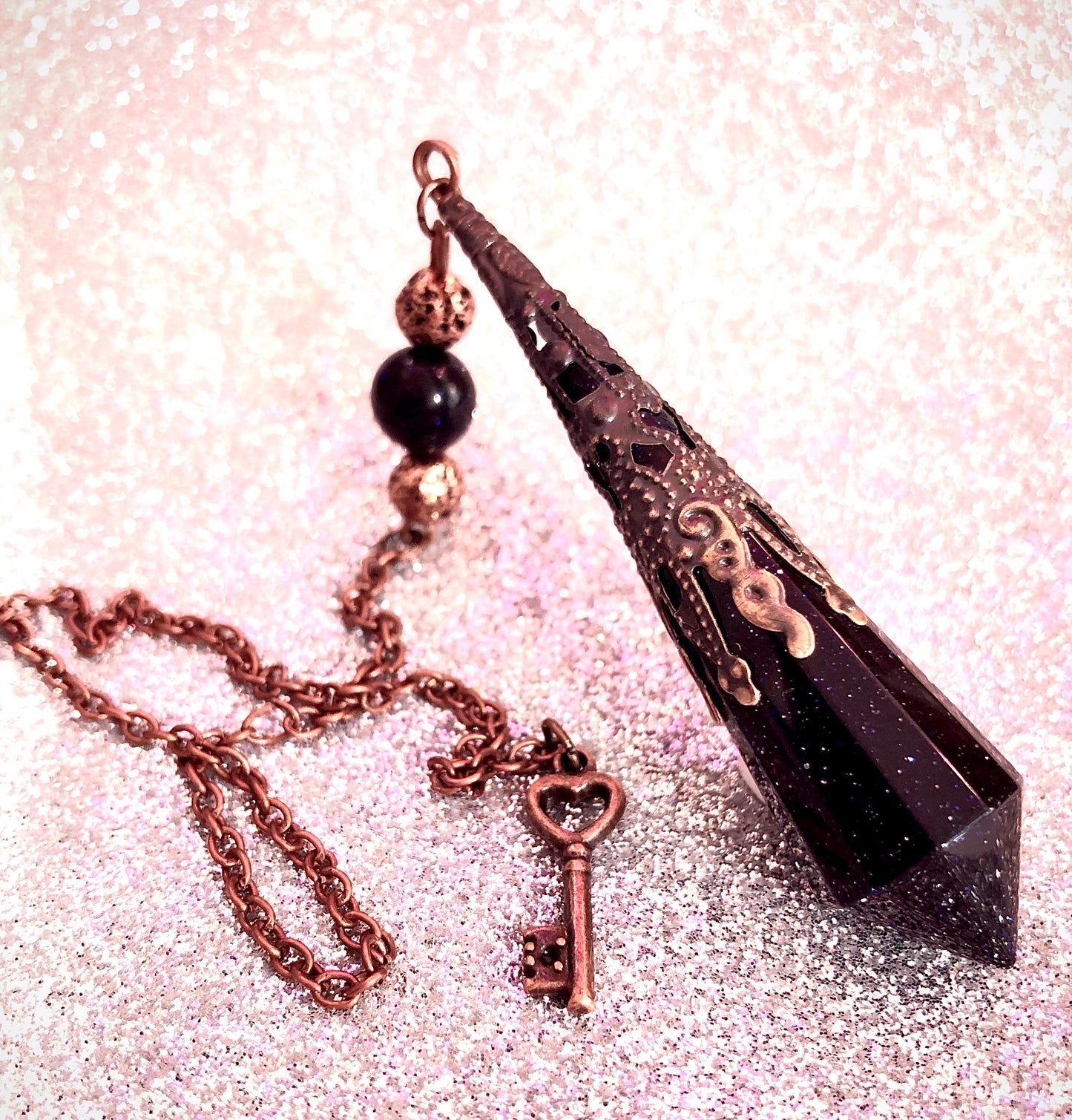 Nightstone and copper pendulum