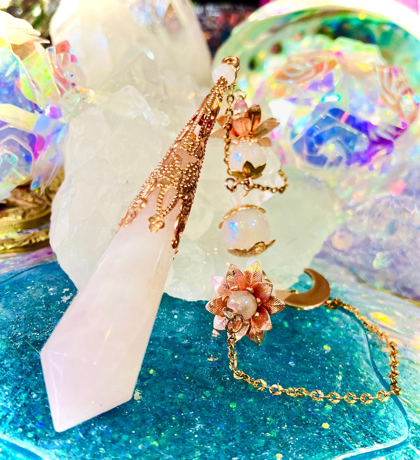 Crystal and aura quartz pendulum with cracked angel flower