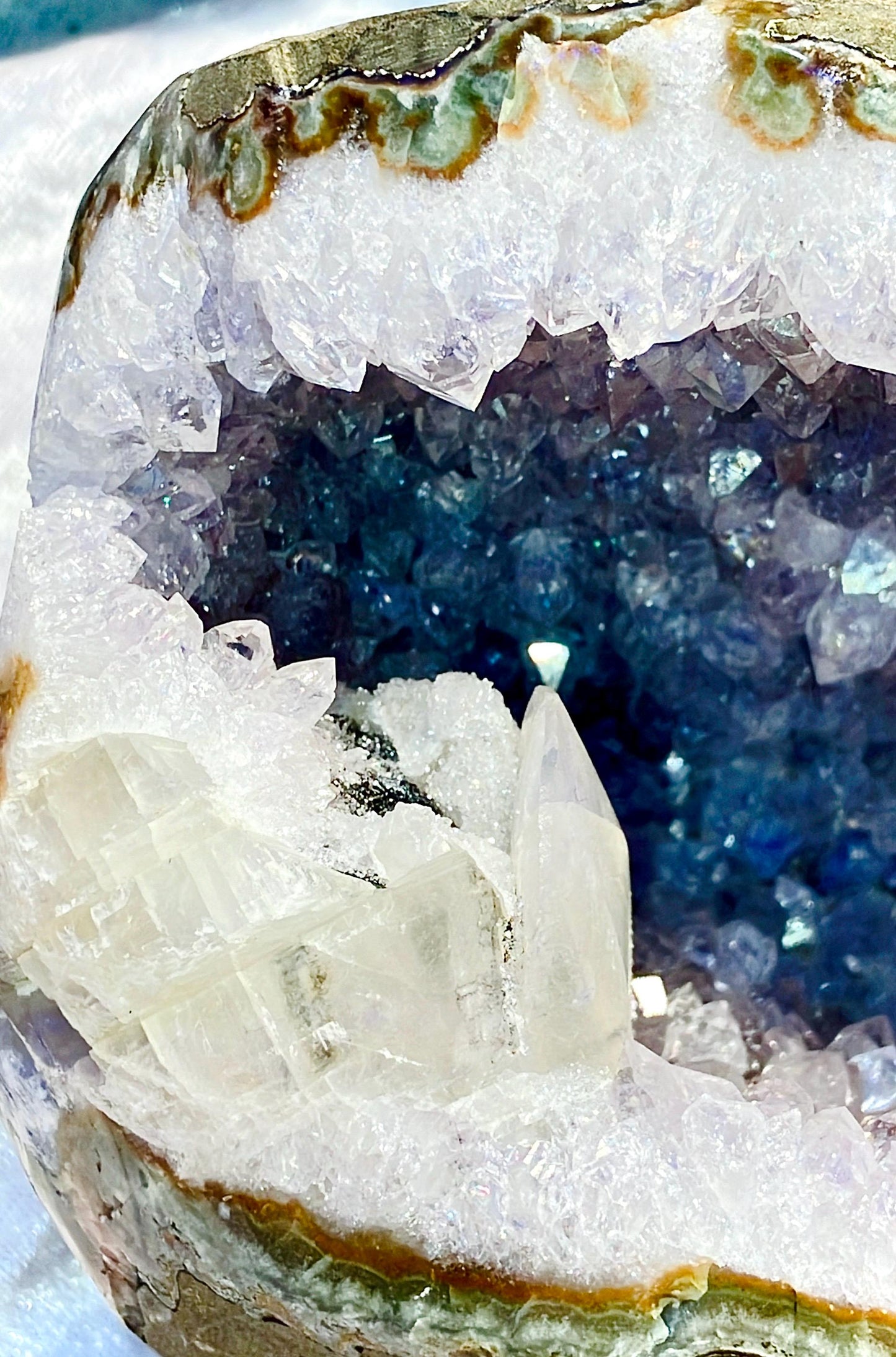 Large amethyst geode with calcite