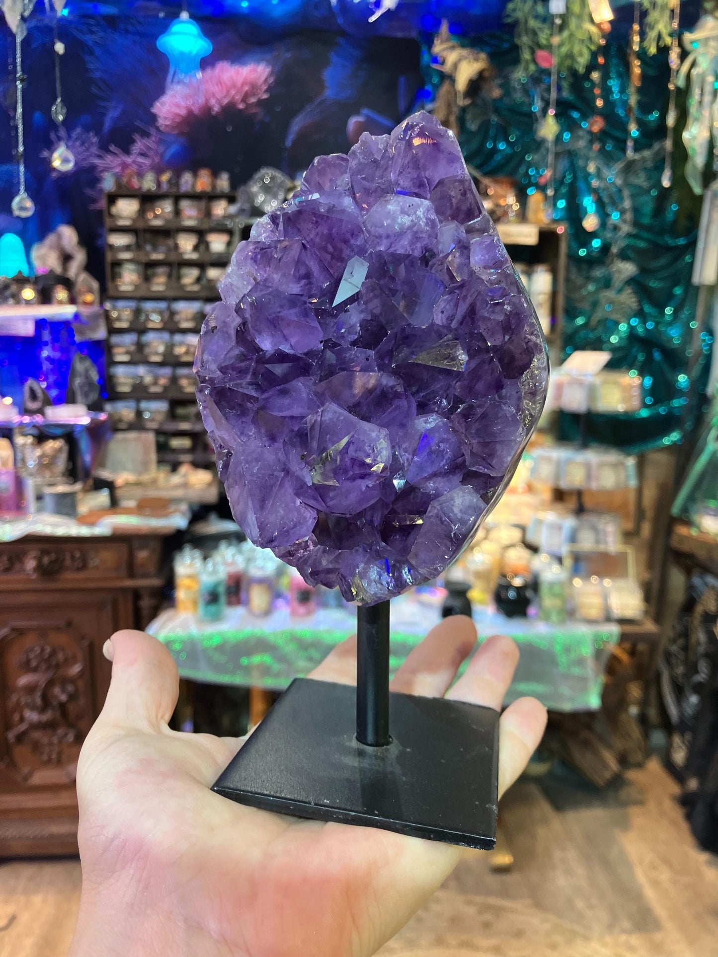 amethyst geode on iron base