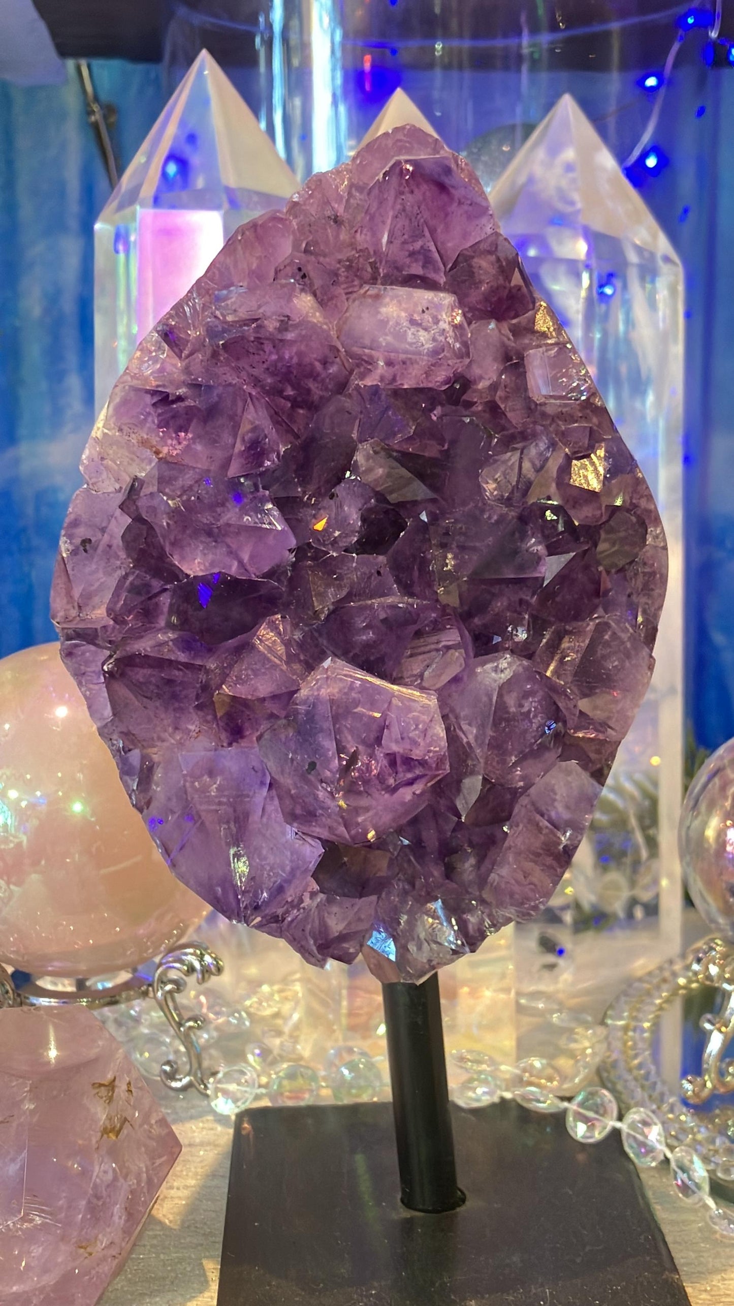 amethyst geode on iron base