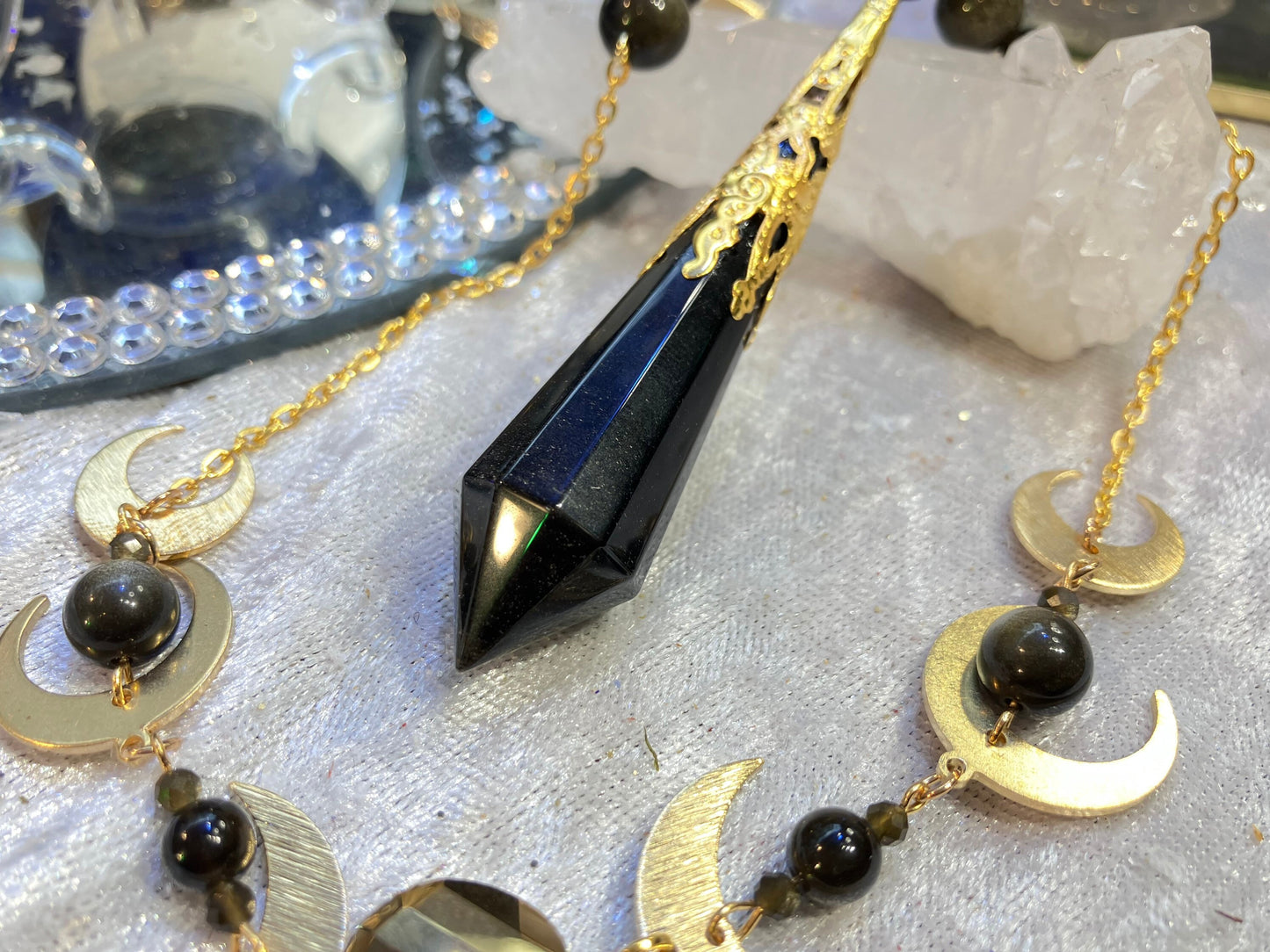 Pendule obsidienne dorée