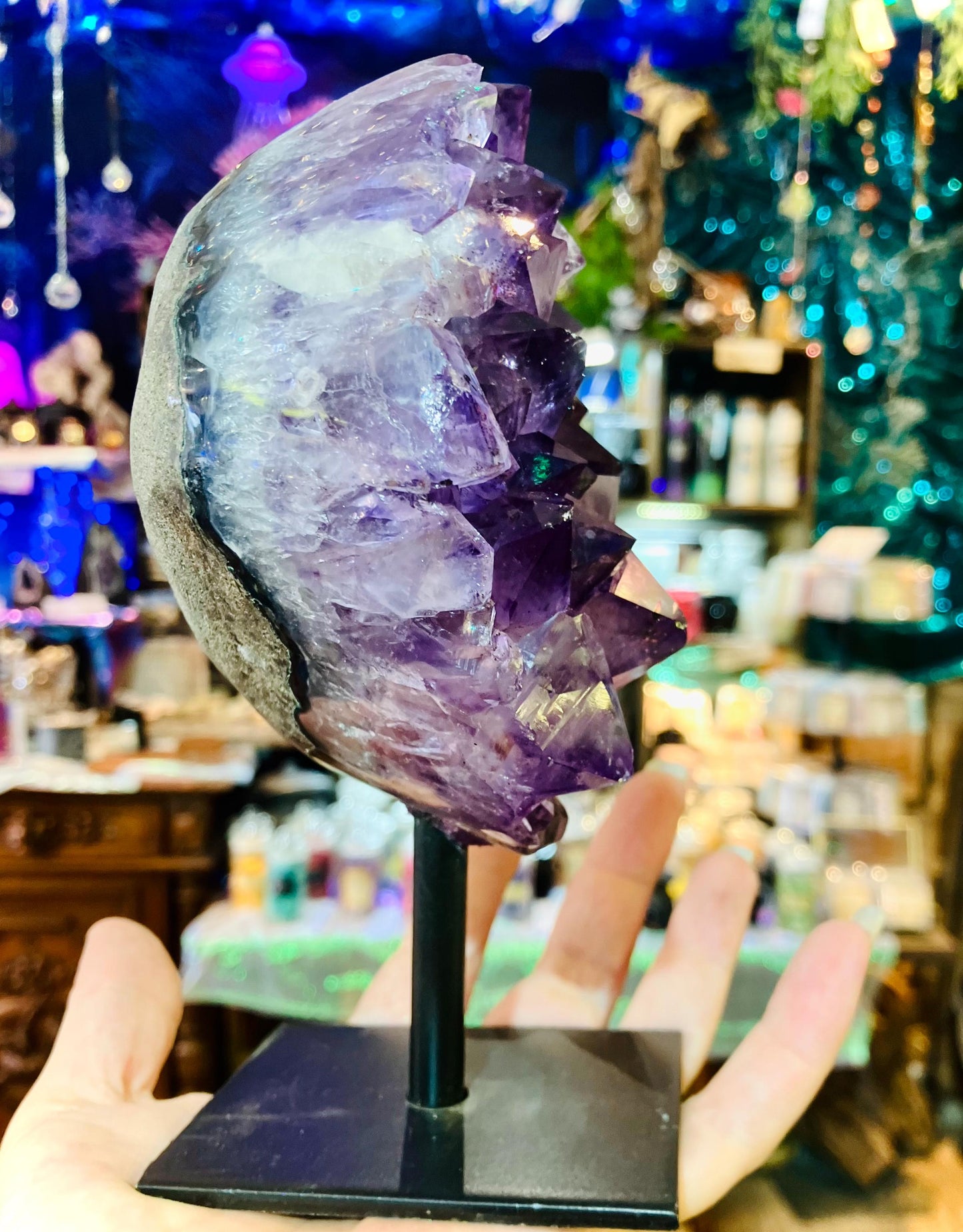 amethyst geode on iron base