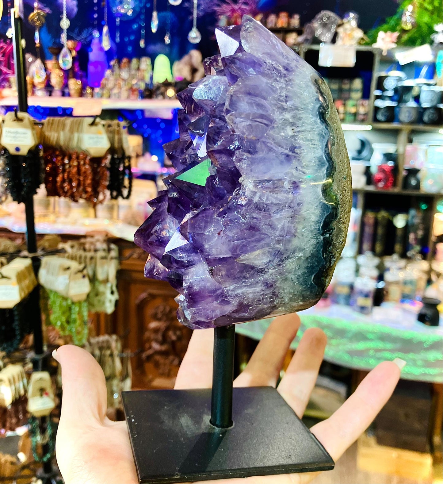 amethyst geode on iron base